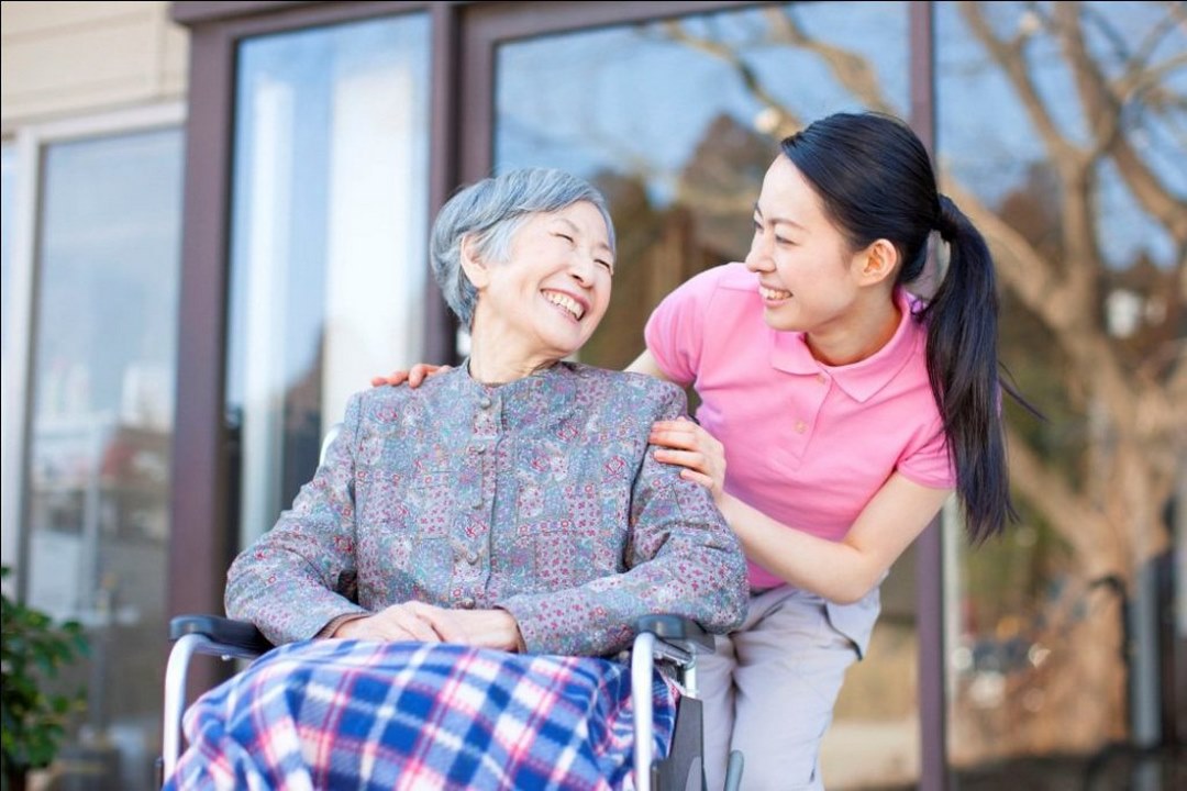 Elderly care with empathy a caregiver and resident enjoying a heartfelt conversation outdoors