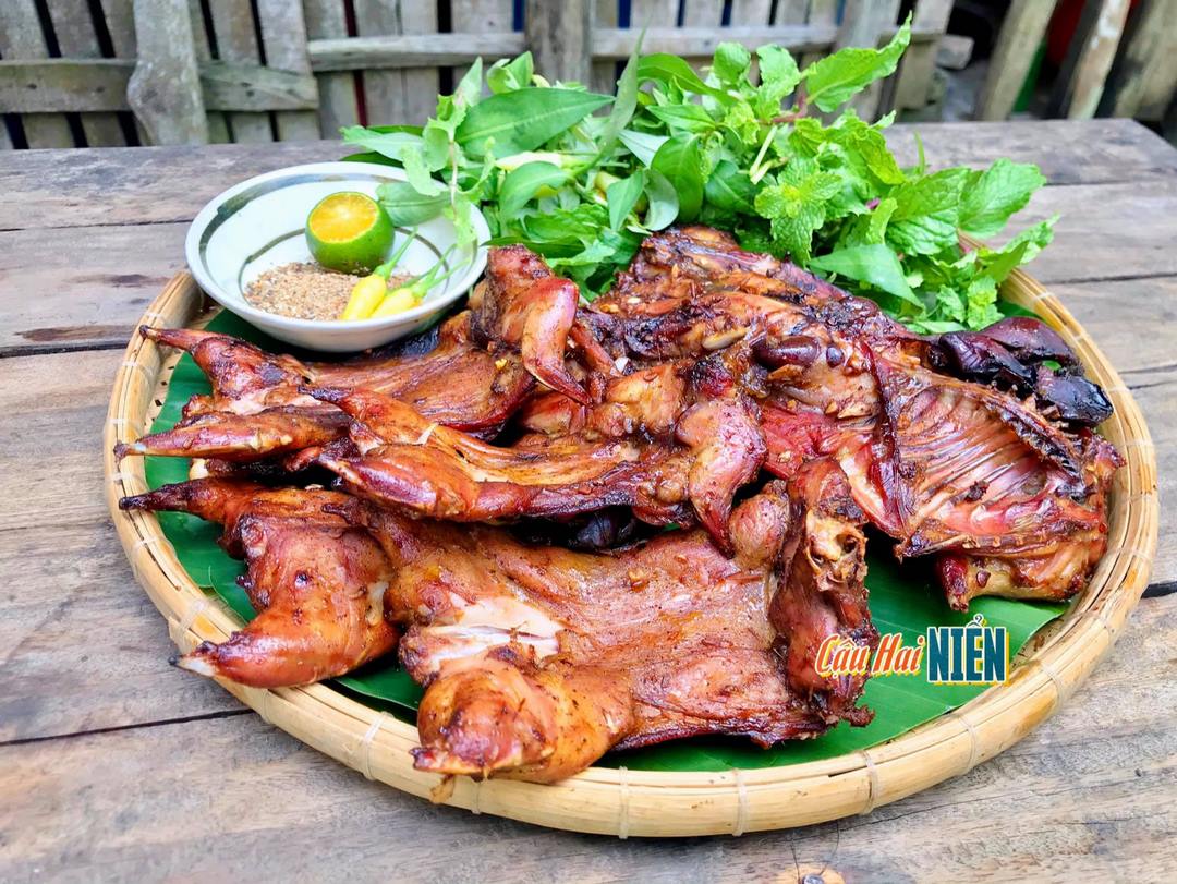 Grilled field mouse—a rustic Mekong Delta specialty with chili salt and fresh herbs