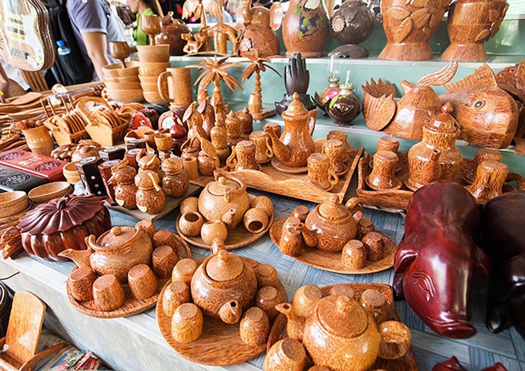 Handcrafted coconut-wood souvenirs - teapots and decor carved from the local signature material