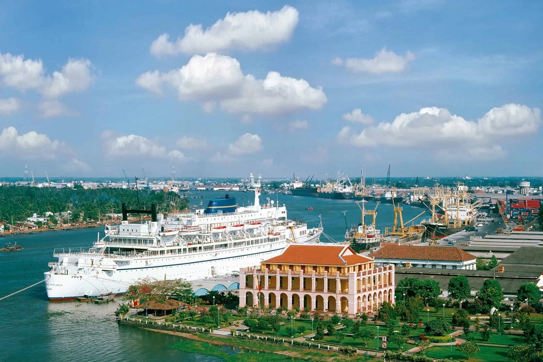 Saigon River waterfront with a cruise ship docking near Nha Rong Wharf, Ho Chi Minh City