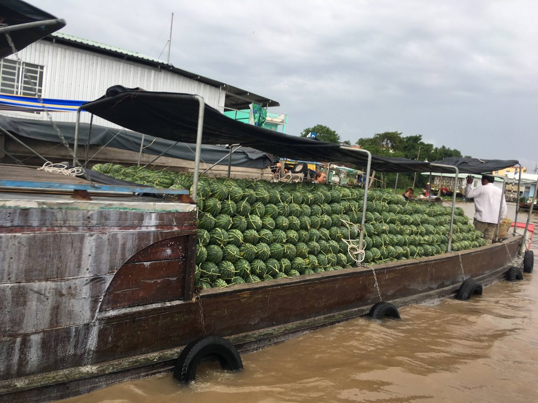 Sampans weave through Cai Rang Floating Market, Can Tho