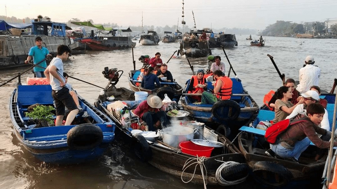 A busy river ferry transporting local passengers and goods – daily life scenes from the public ferry route in the Mekong Delta