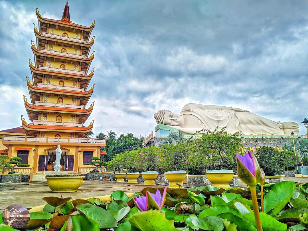 Scenic panoramic view of Vinh Trang Pagoda with its lotus pond and grand Buddha statue, Tien Giang, Vietnam
