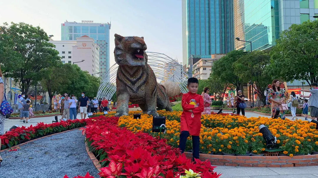 Nguyen Hue Flower Street celebratory crowds and cultural art installations at Tet