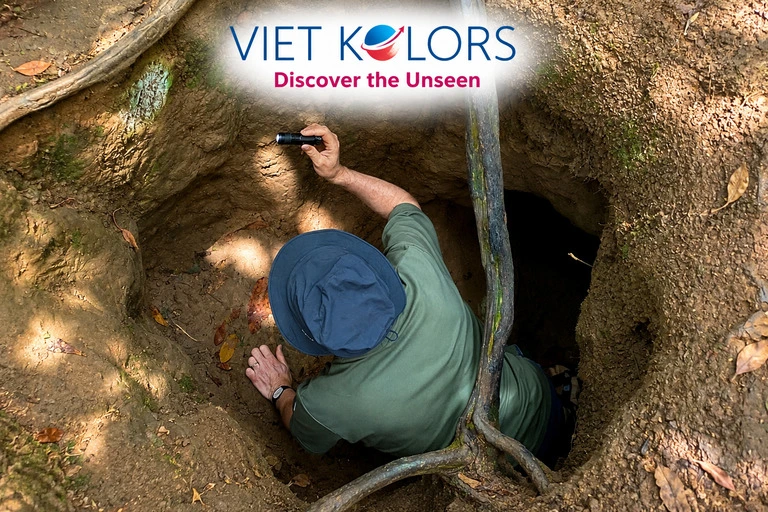 Visitors observing a recreated wartime shelter that illustrates the daily life and living conditions inside the Cu Chi Tunnels. Visitors observing a recreated wartime shelter that illustrates the daily life and living conditions inside the Cu Chi Tunnels.